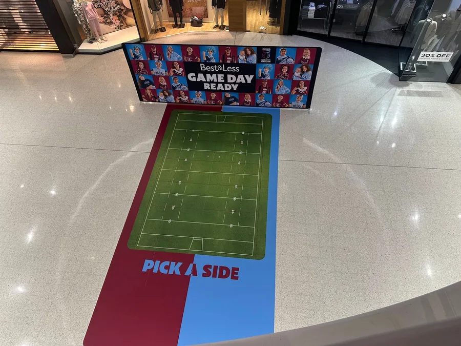 State of Origin floor graphic and back wall panel installed in a shopping centre walkway